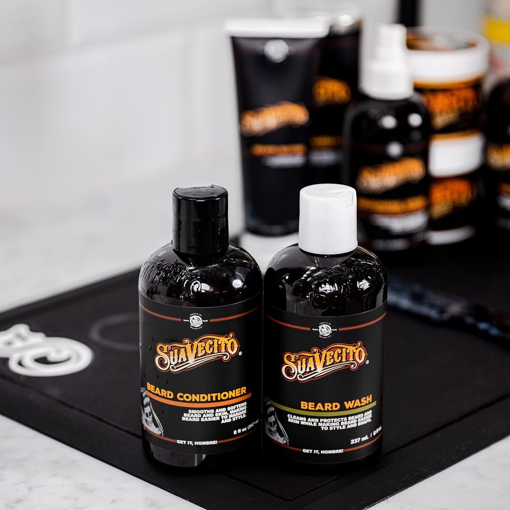 Suavecito Beard Wash lather shown during application for thorough cleansing.