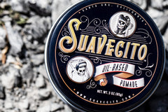 Suavecito Oil Based Pomade hands warm application demonstrates pliable hold for shaping.