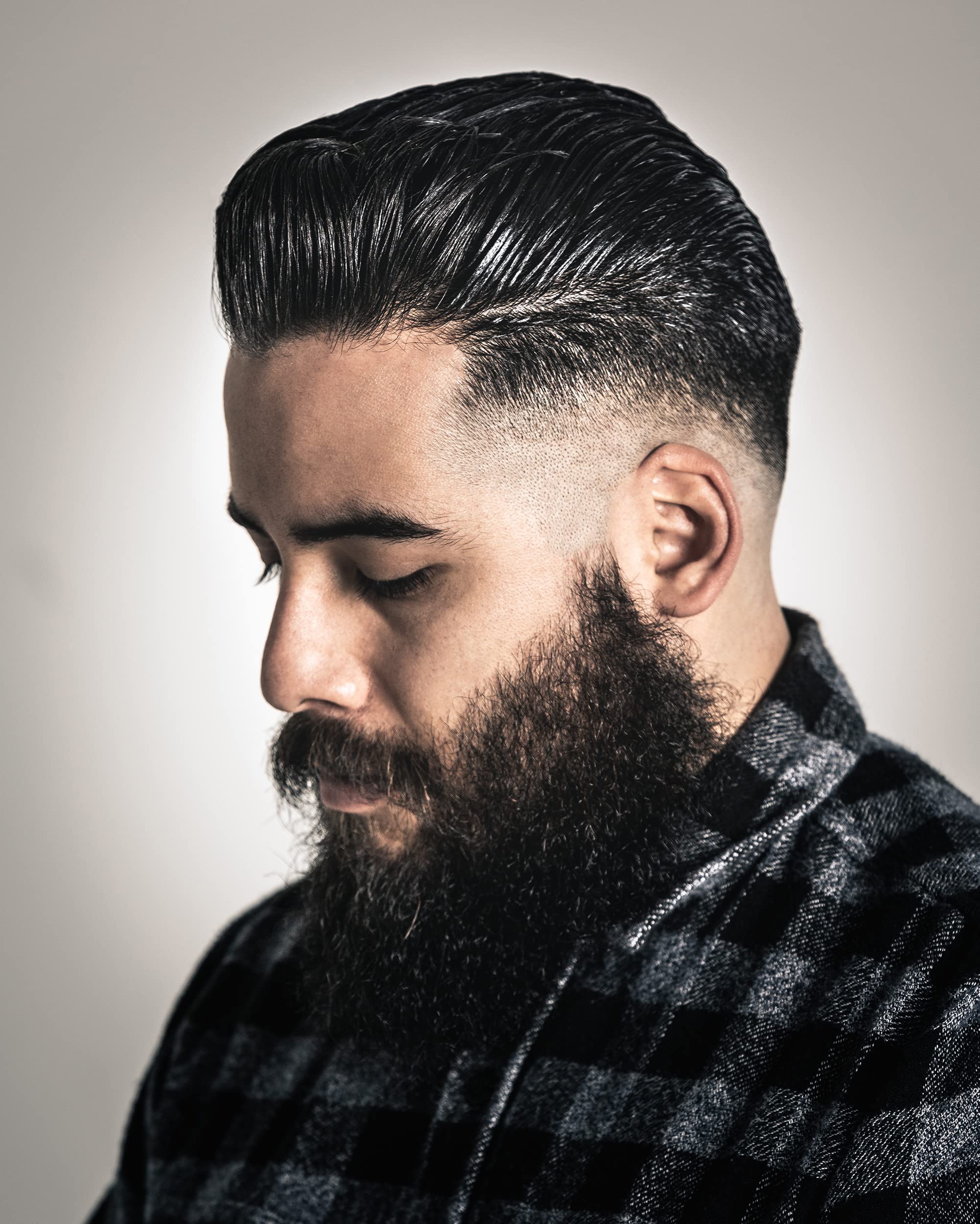 Suavecito Oil Based Pomade slick-back look with lasting shine and controlled hold.