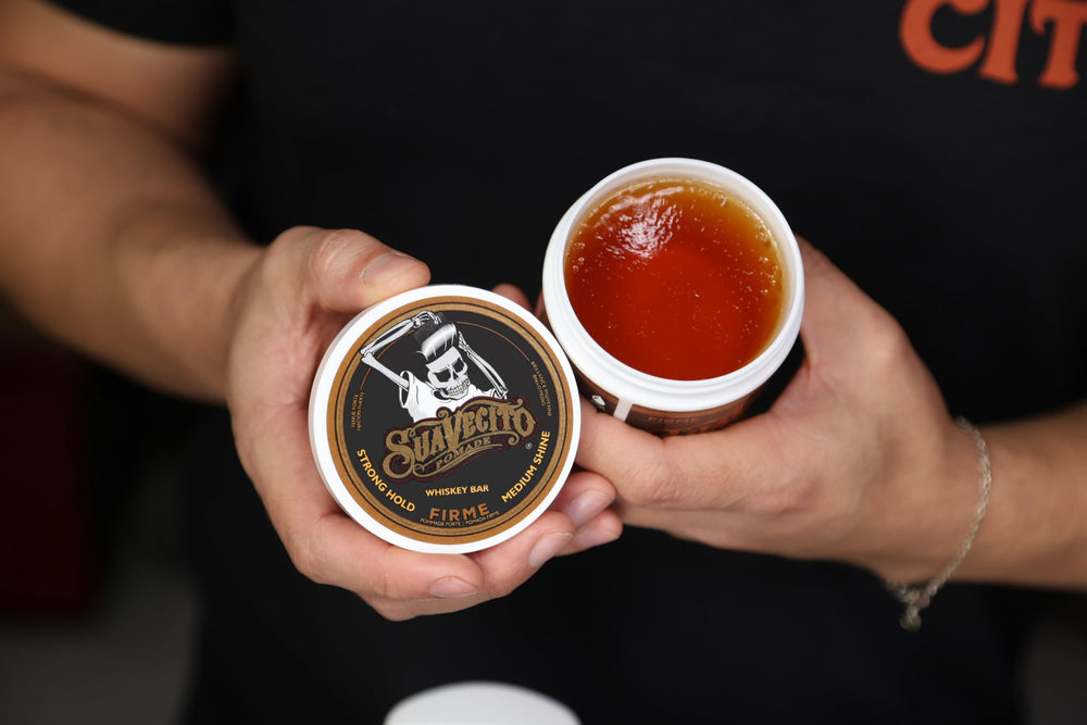 Suavecito Pomade Firme fragrance-profile label hints at whiskey cedar notes.