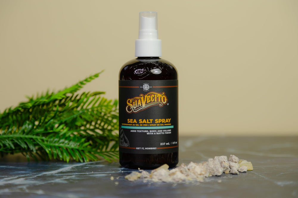 Sea salt and charcoal imagery with Suavecito Sea Salt Spray for refreshing feel.