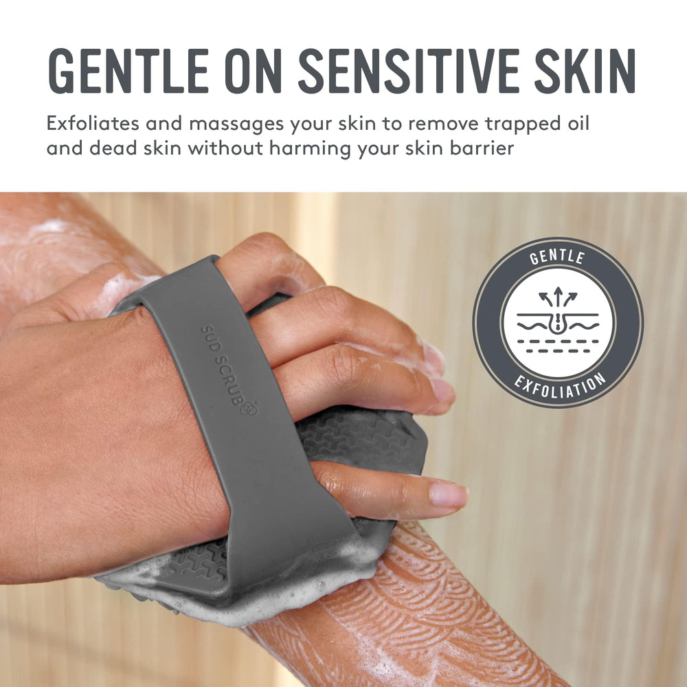 Sud Scrub antimicrobial silicone body scrubber in hand shows non-slip grip.