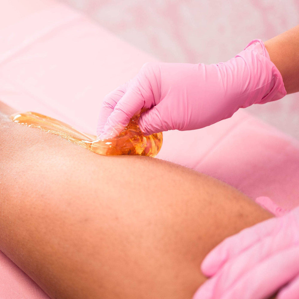 Legs treated with Sugaring NYC paste for even hair removal results.