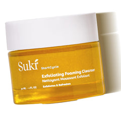 Suki Skincare Exfoliate Foaming Cleanser bottle shows gentle exfoliation for radiant skin