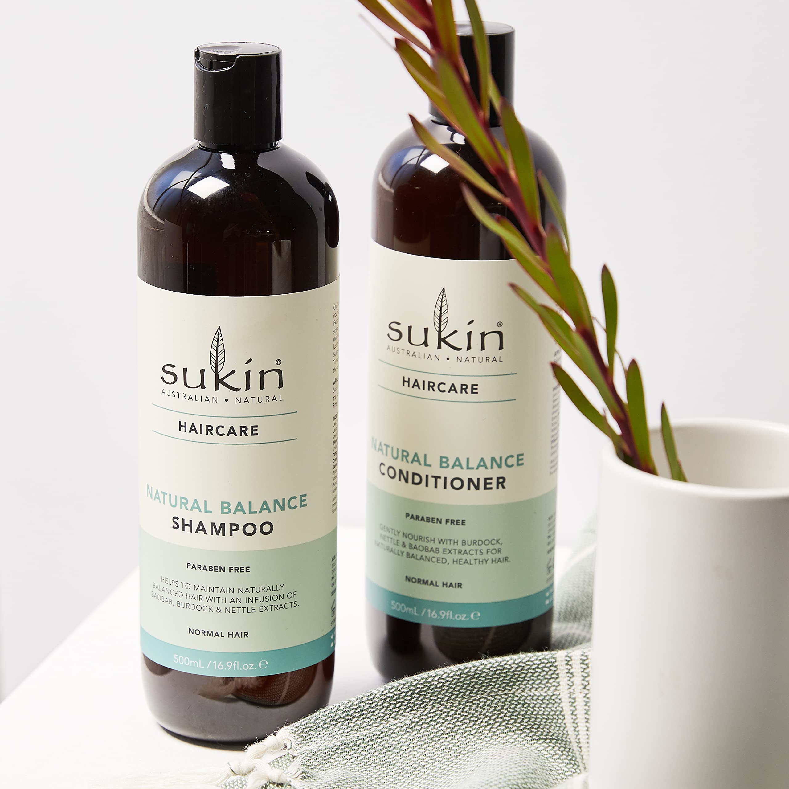 Sukin Natural Balance Shampoo lather shows gentle cleansing suitable for daily use.