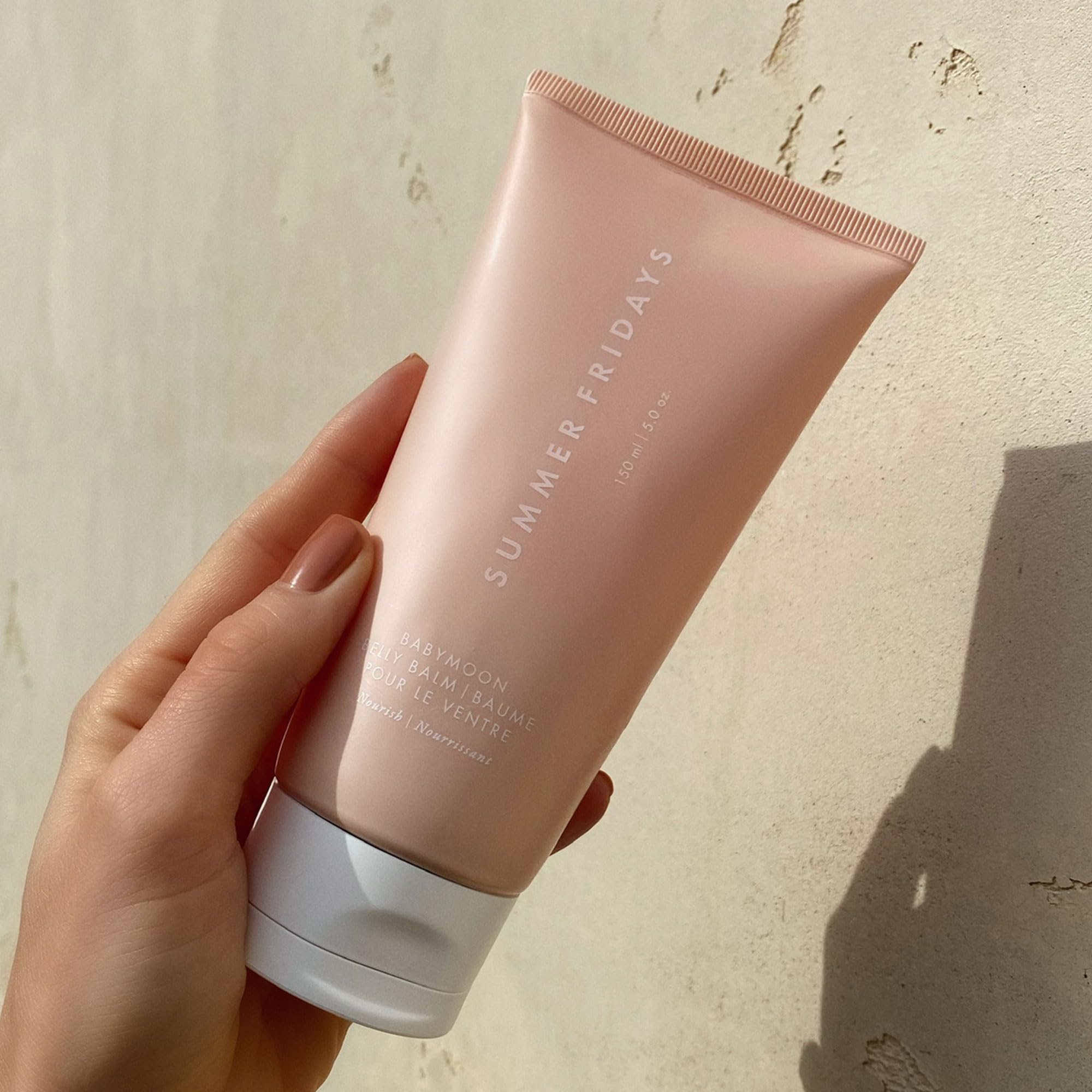 Summer Fridays Babymoon Belly Balm being applied to dry belly skin.