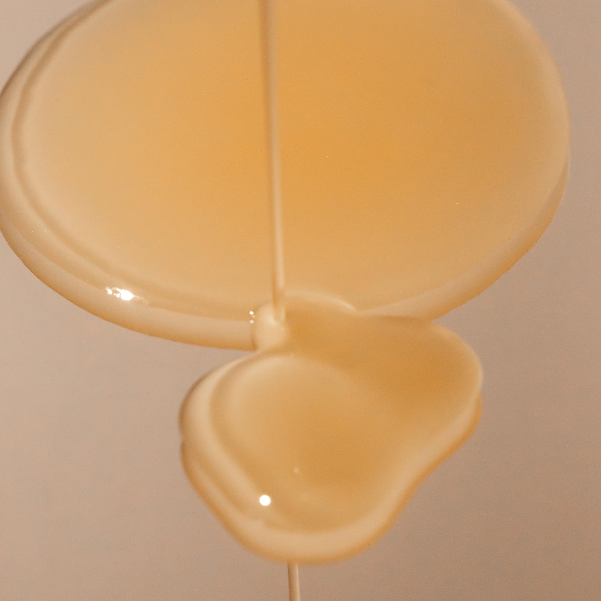 Texture closeup of Summer Fridays CC Me Serum appears lightweight and silky.