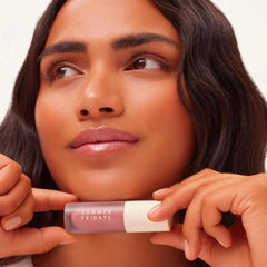 Summer Fridays lip oil tinted-gloss on lips for a non-sticky shine.