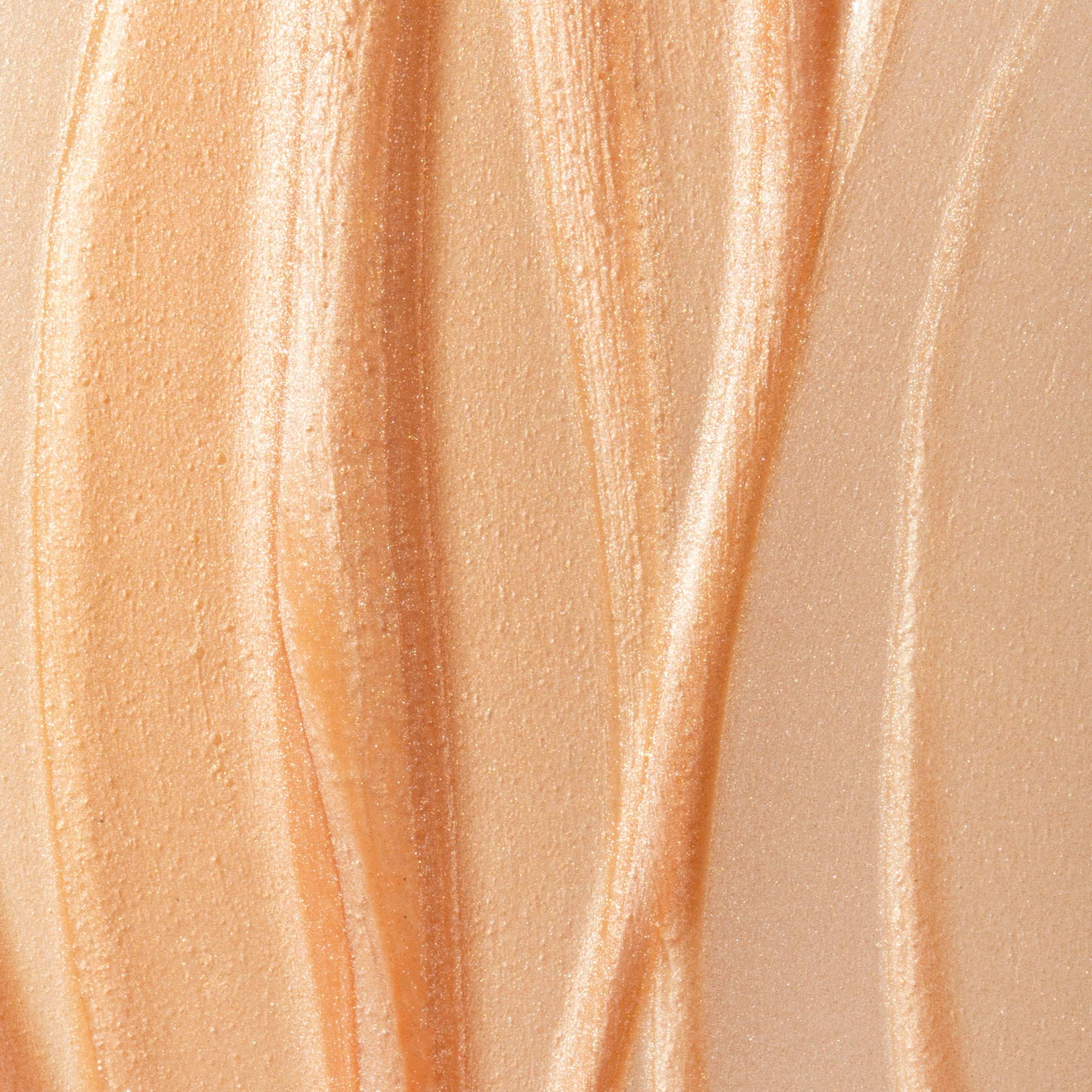 Summer Fridays Illuminating Drops on bare skin for a glass-skin effect.