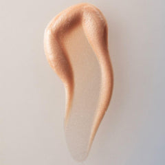 Summer Fridays Illuminating Drops glow on cheeks for a dewy, glass-skin look.