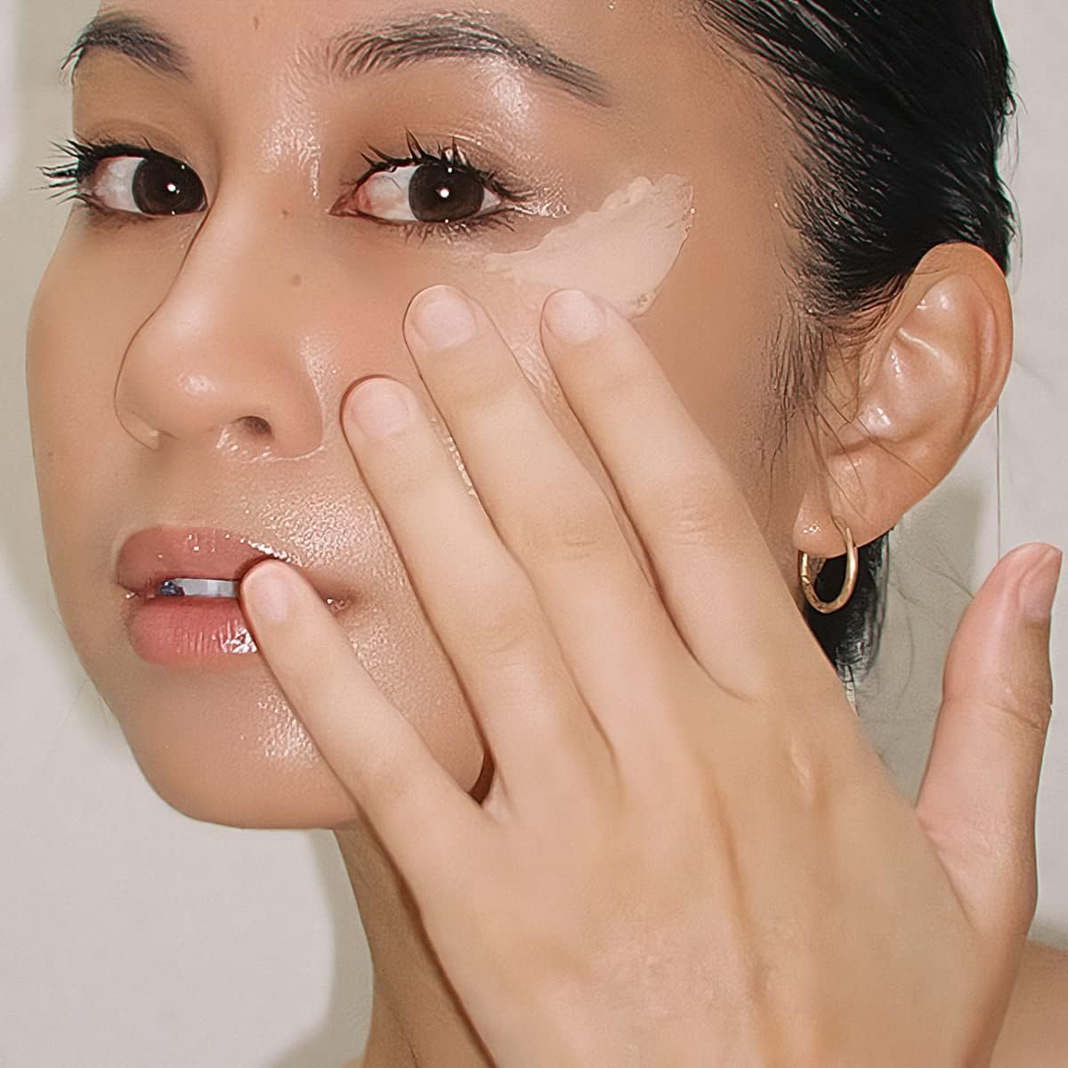 Summer Fridays Light Aura Eye Cream close-up highlighting brightening effect on skin