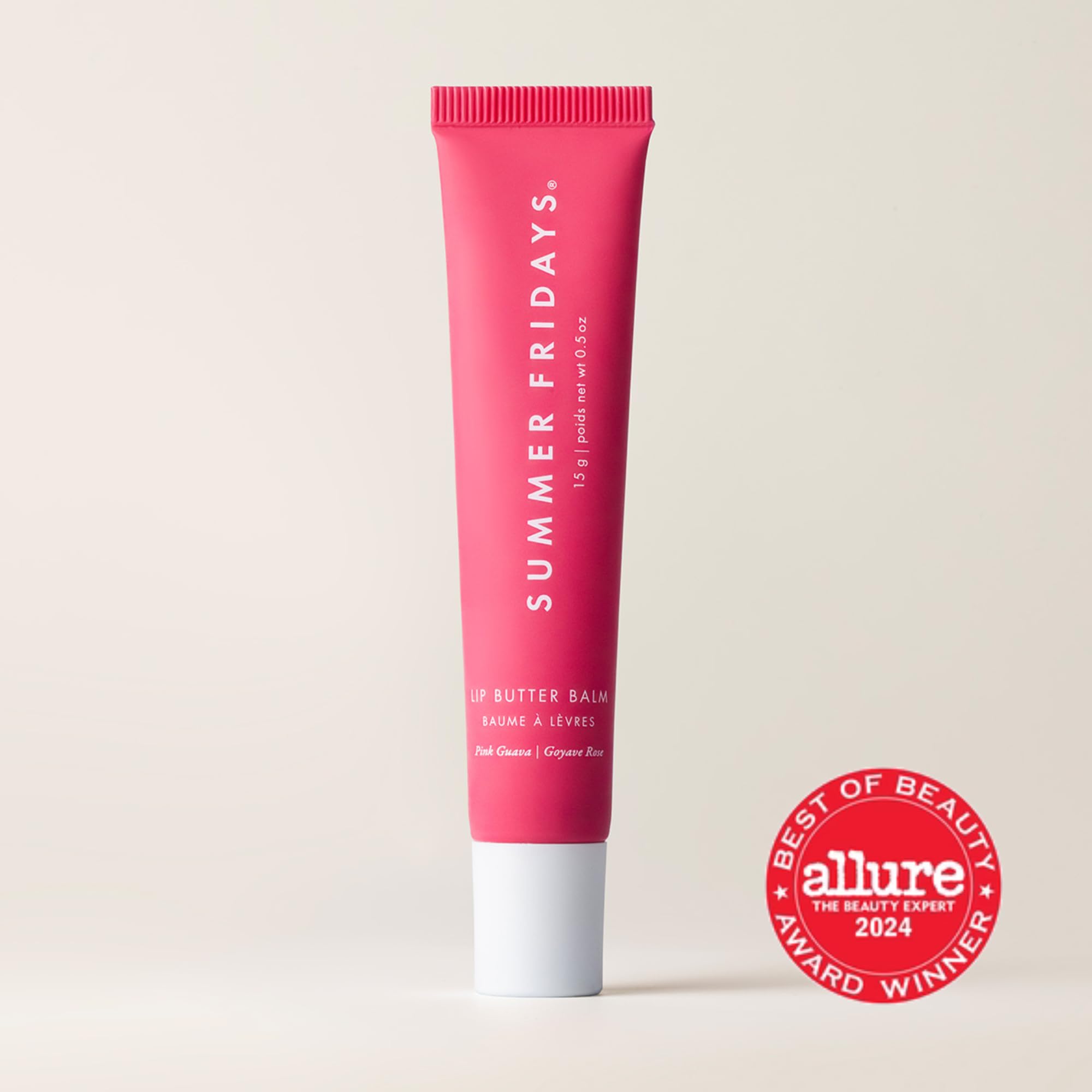 Summer Fridays Pink Guava lip balm on lips showing sheer color.
