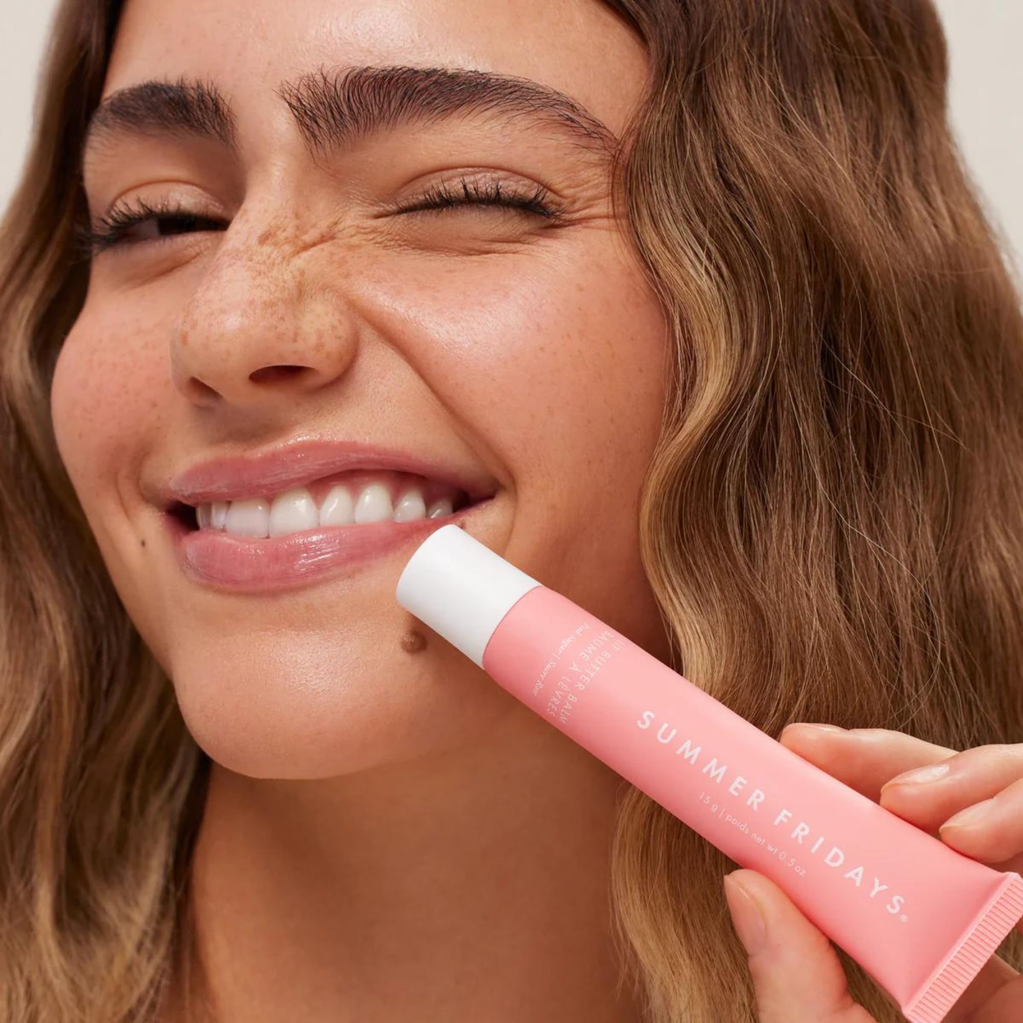Summer Fridays Pink Sugar sheer color swatch on lips with subtle glow.