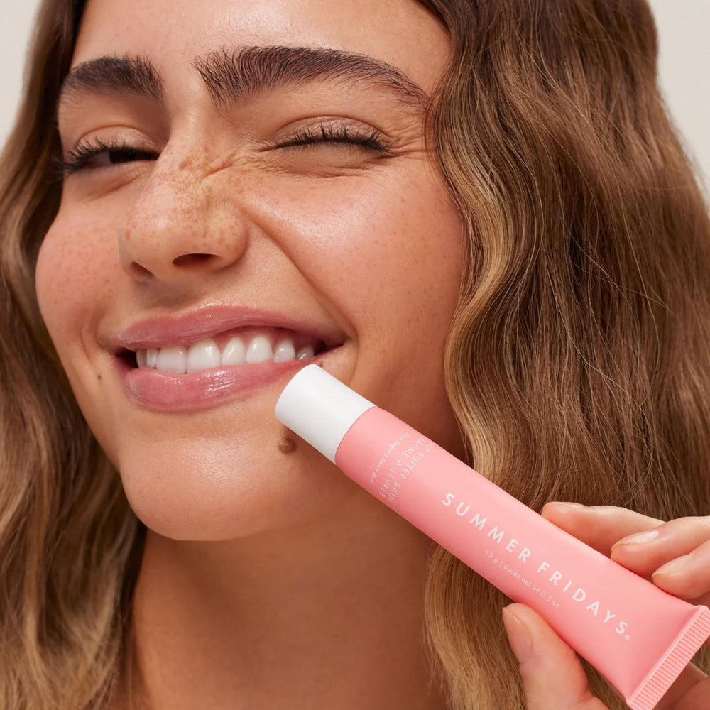 Summer Fridays Pink Sugar sheer color swatch on lips with subtle glow.