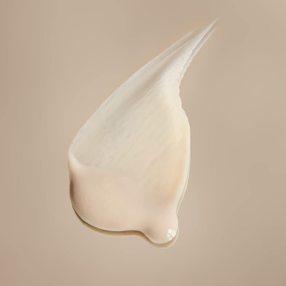 Swirl-on-skin image shows satin-like texture and subtle glow after application.