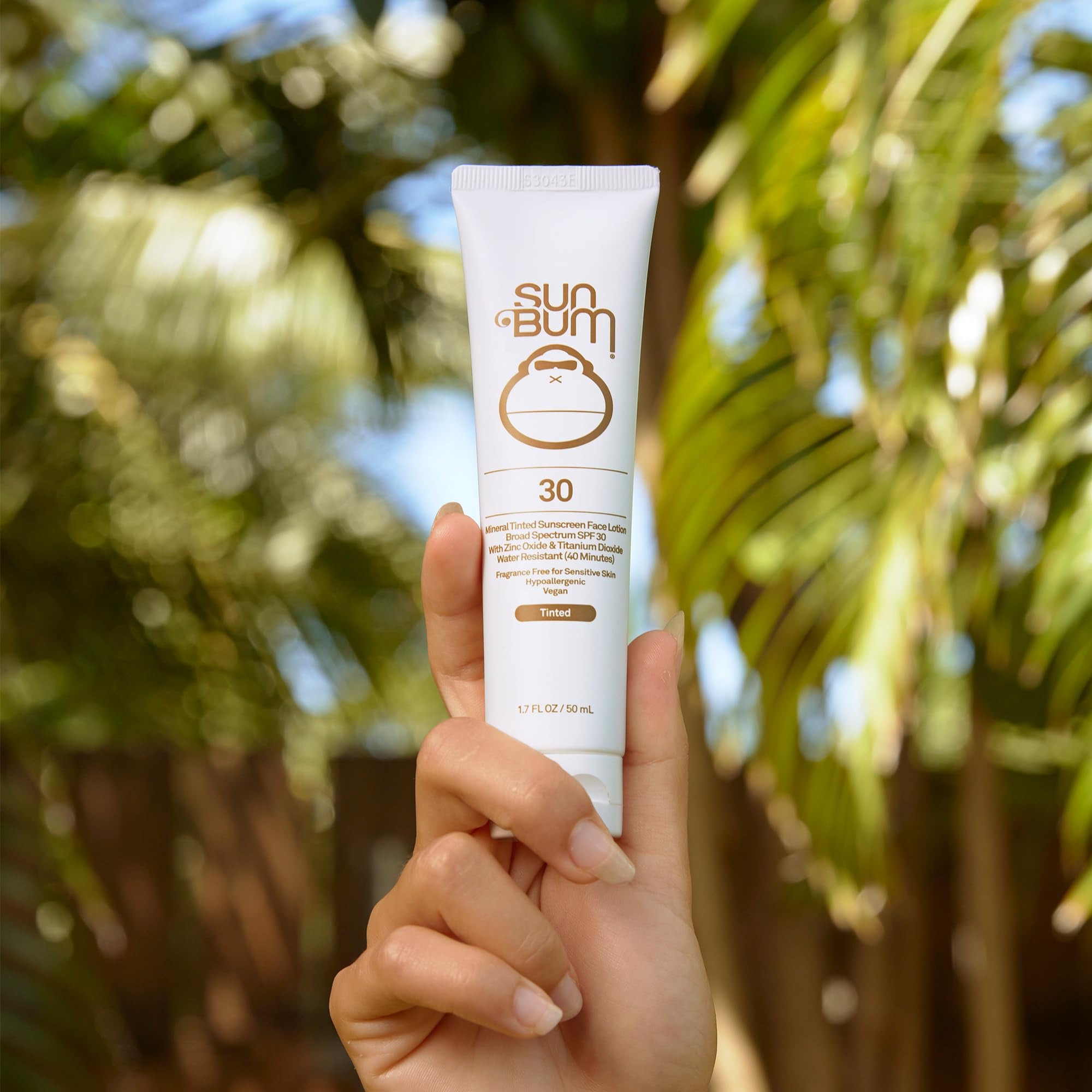 Close-up of Sun Bum tinted mineral sunscreen showing a matte finish