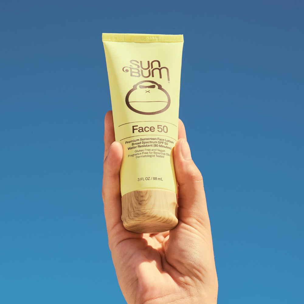 Close-up of Sun Bum SPF50 water-resistant sunscreen on skin during activity.