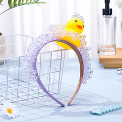 Suncalla duck and soap bubble headband on model showcases one-size-fits-most comfort.