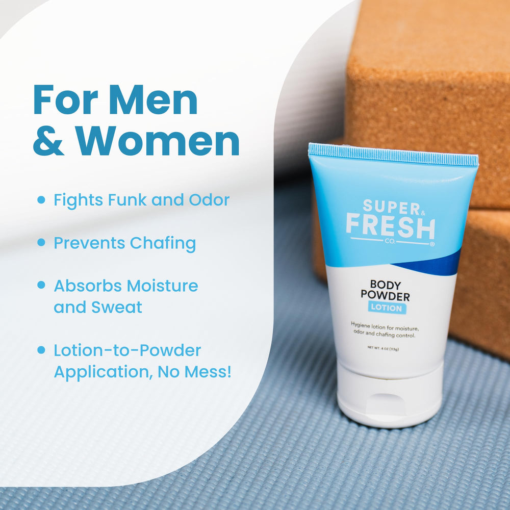 Woman applies SweatBlock under bust for discreet odor control.