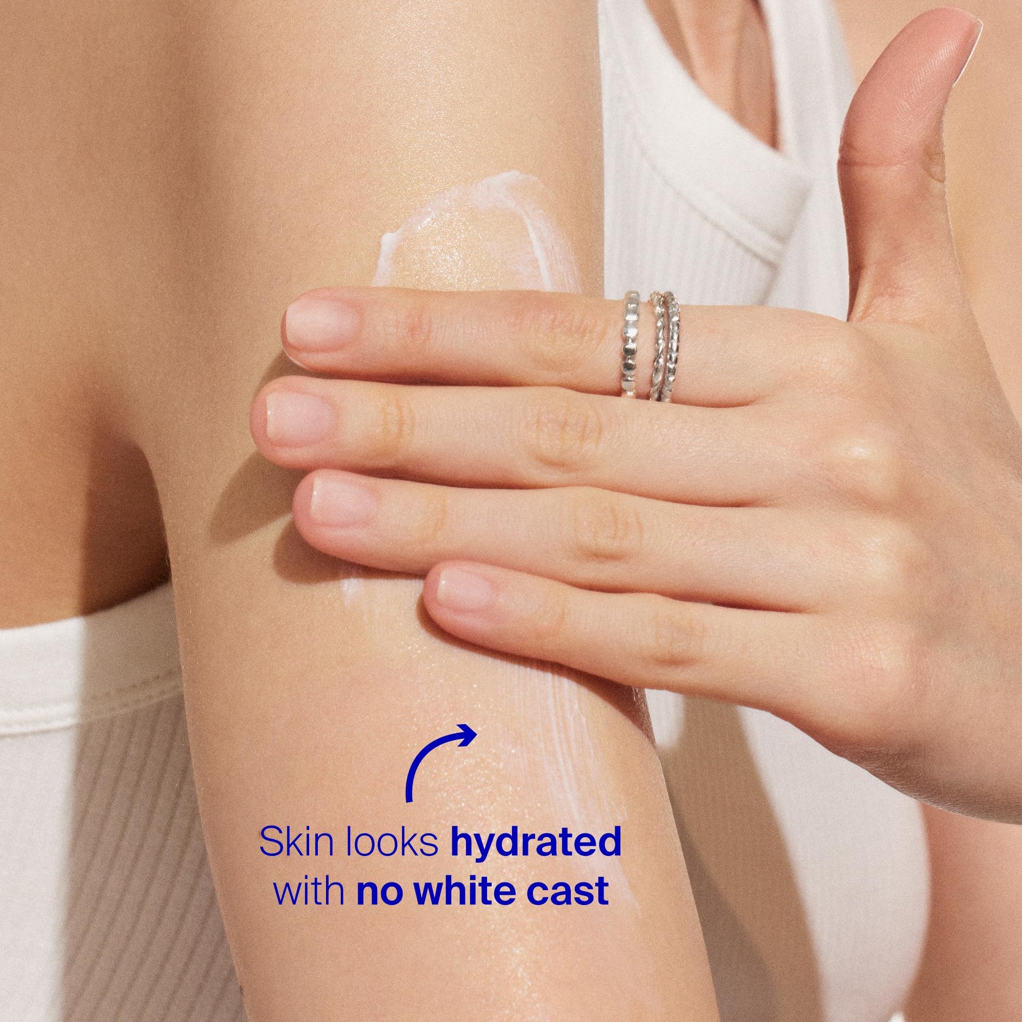 Palm with water droplets and Supergoop! PLAY Everyday SPF 30 lotion to show water resistance.