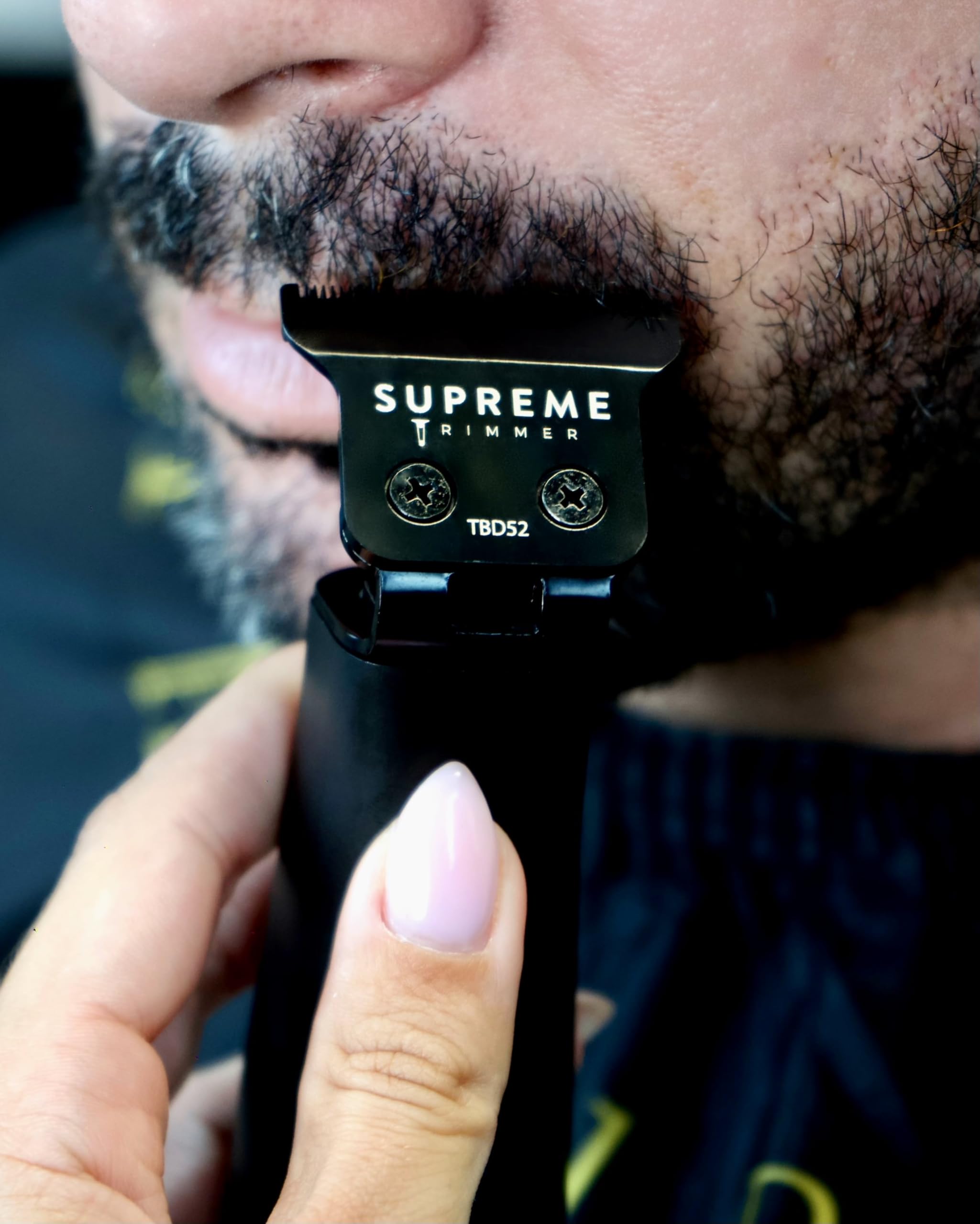 Supreme Trimmer trimming a beard illustrating quiet performance and sensitive-skin comfort