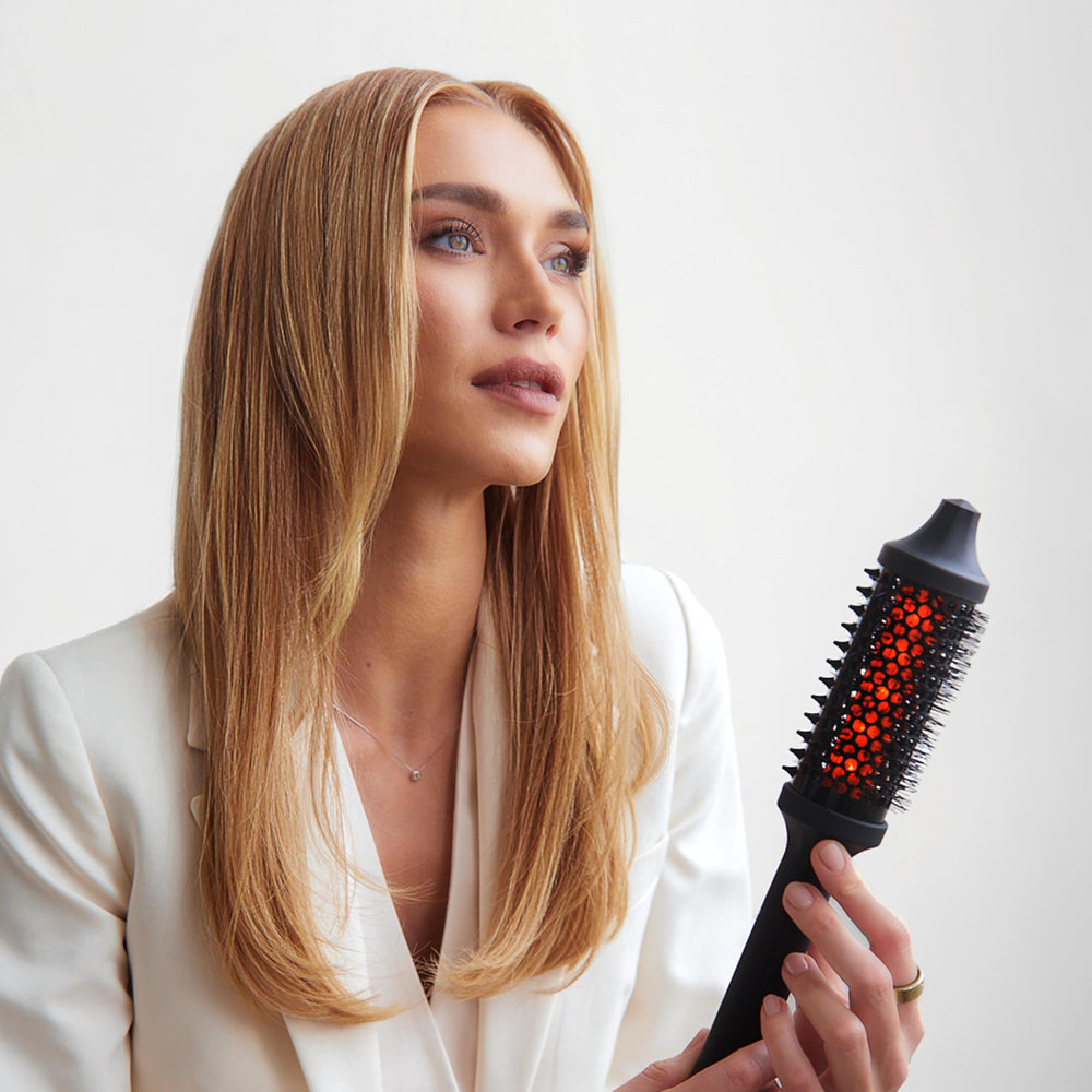 Sutra Thermal Brush in action delivering fast, volumized blowouts with healthy heat styling.