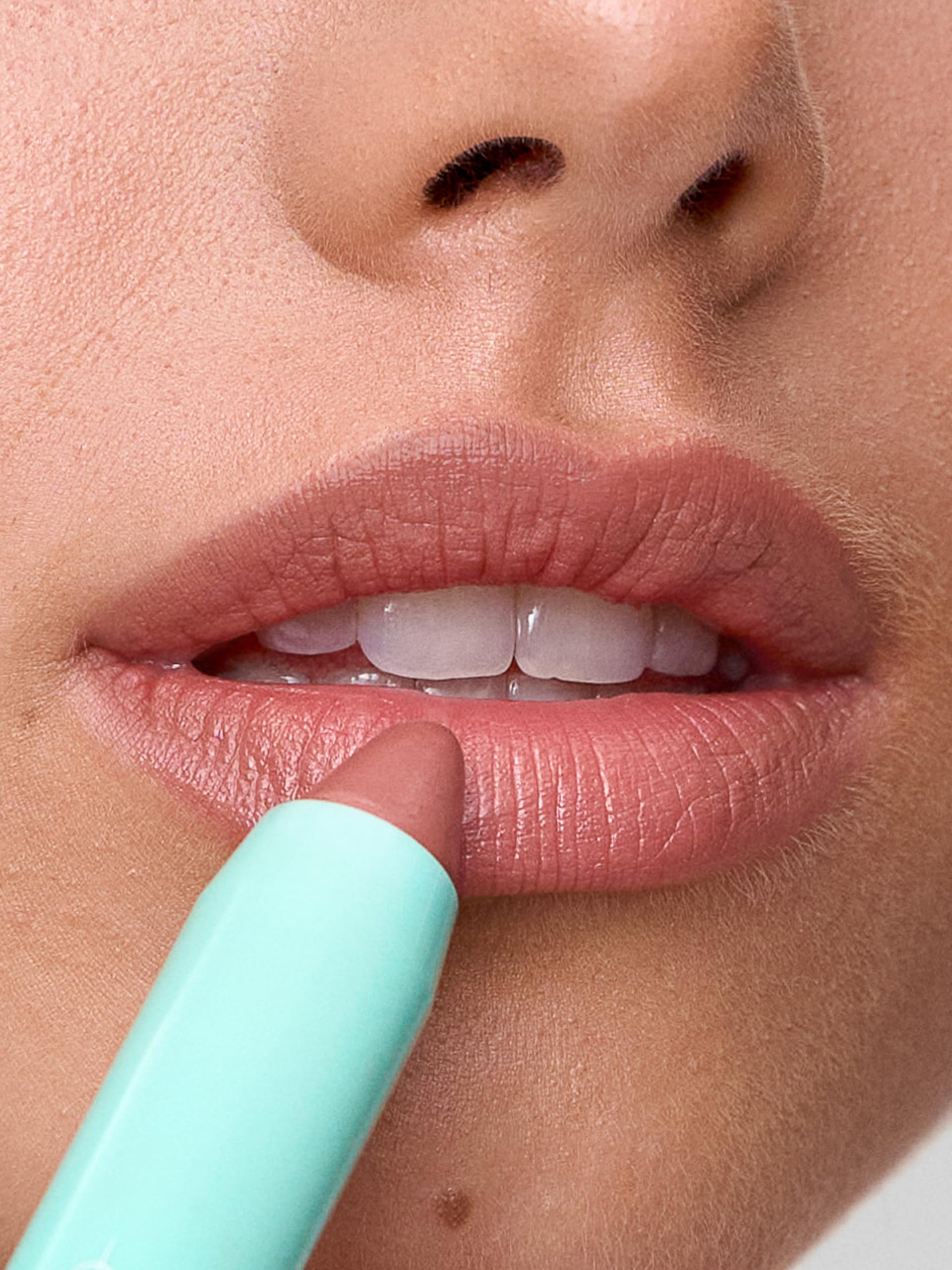 Sweed Le Lipstick nude pink swatch showing buildable color payoff.