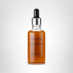 Tan-Luxe Body Illuminating Self-Tan Drops being applied for streak-free, even-toned results.