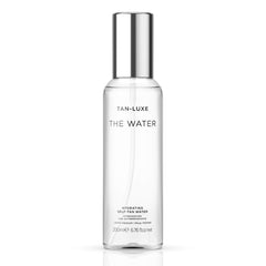 Tan-Luxe The Water bottle front view highlights a hydrating self-tan for a natural glow.
