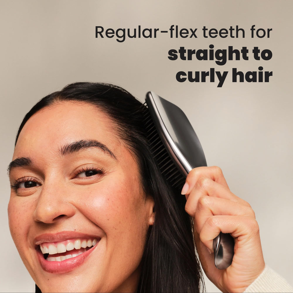 Tangle Teezer Chrome Ultimate Detangler distributing conditioner evenly in shower