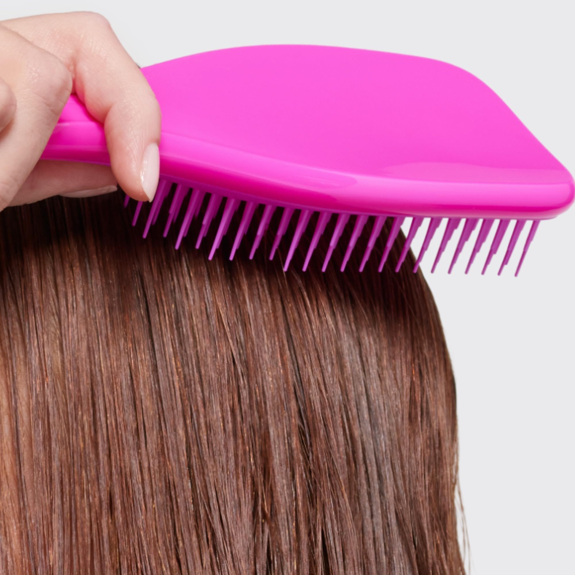Tangle Teezer conditioning treatment distribution using detangler brush