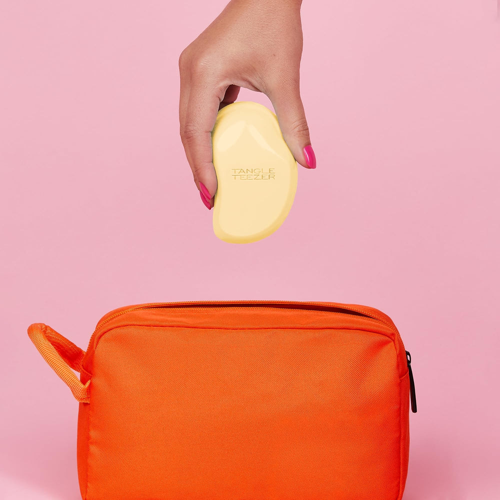 Tangle Teezer Original Detangler buttercup-yellow kid-friendly size makes travel brushing easy.