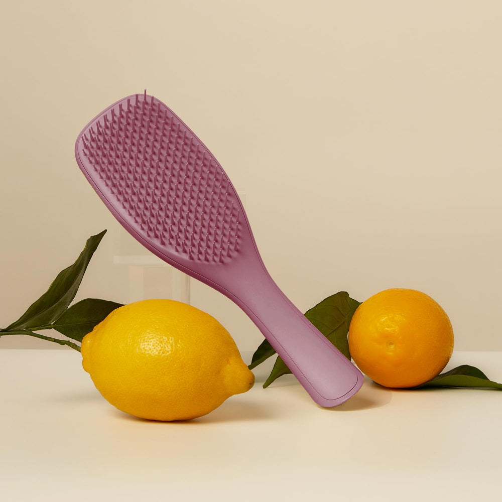 Tangle Teezer Plant-Based Ultimate Detangler Brush closeup of short teeth smoothing strands.