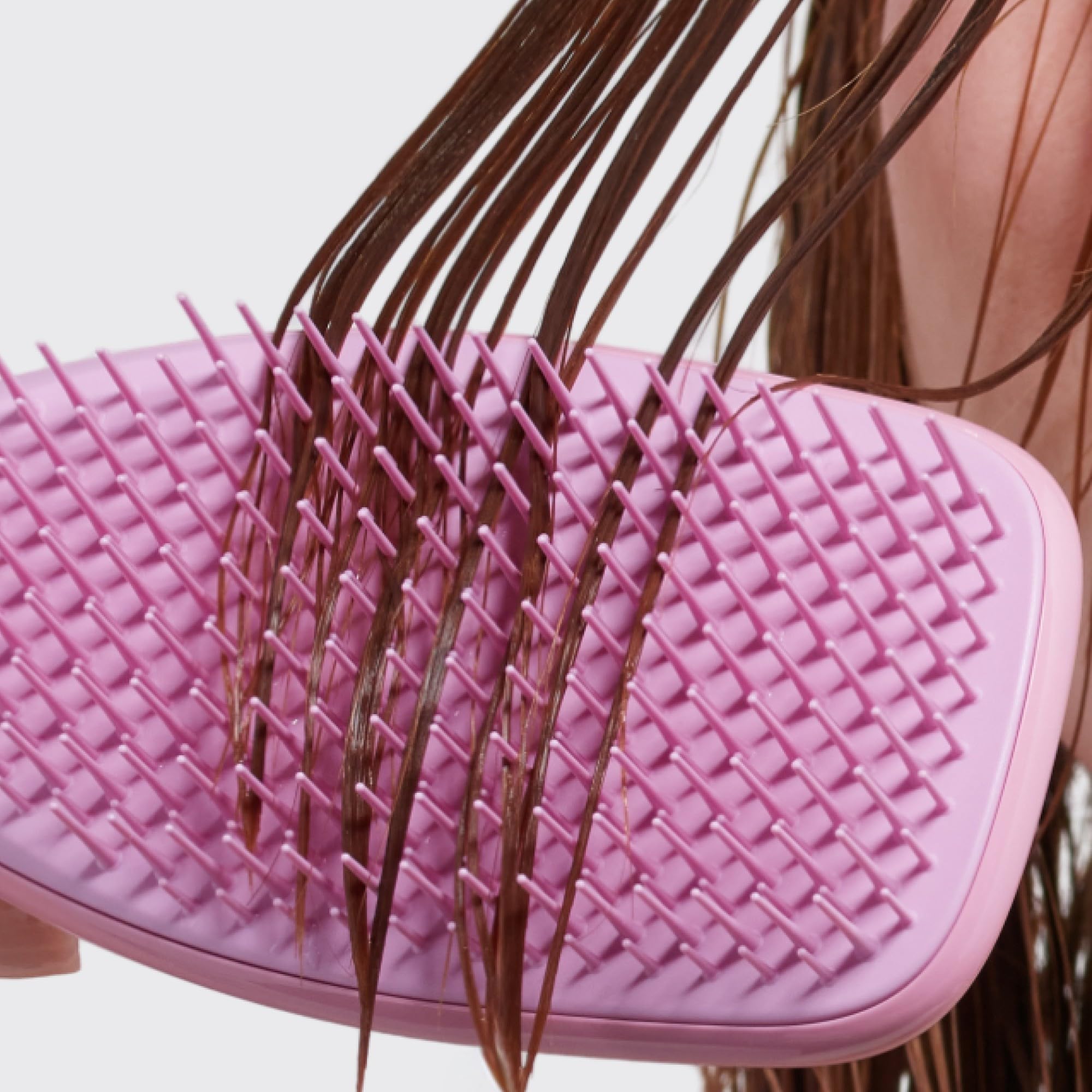 Tangle Teezer Rosebud brush in hand delivers easy on-the-go detangling and care.