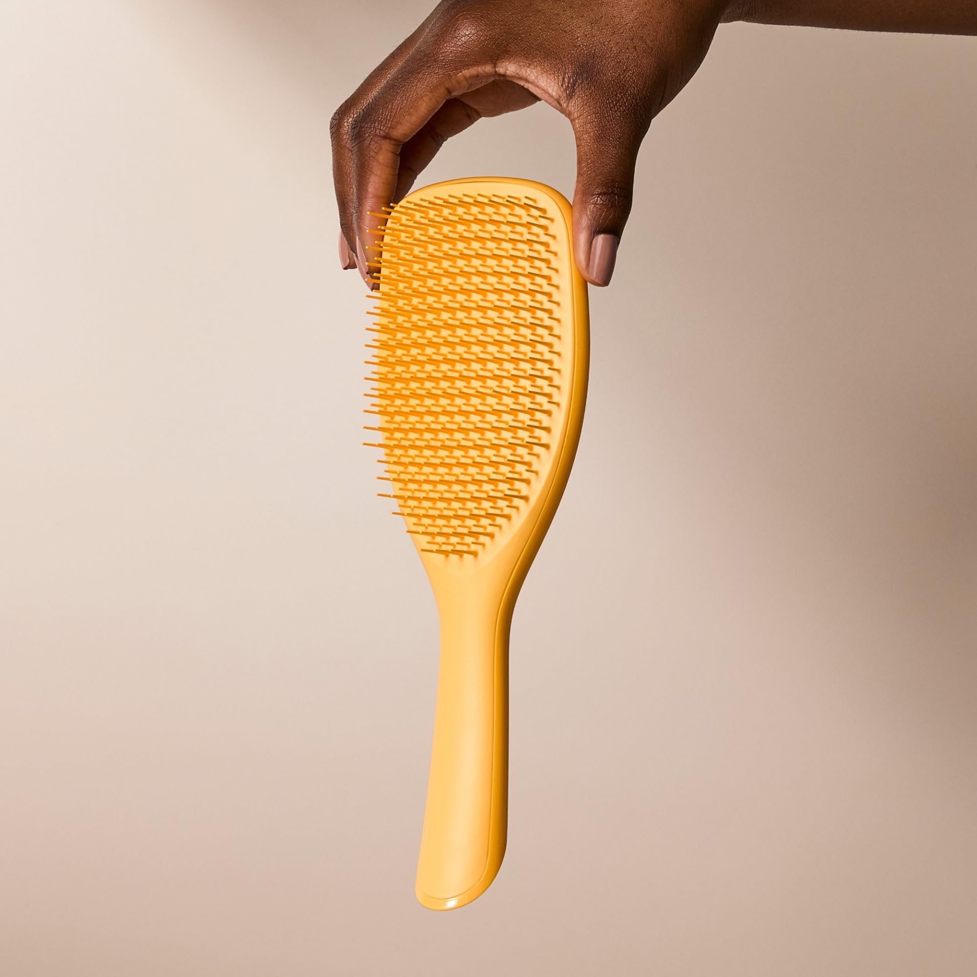 Tangle Teezer Ultimate Detangler in bathroom showing frizz control