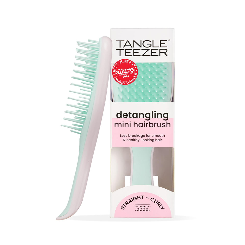 Tangle Teezer Ultimate Detangler closeup showing dual-teeth design for gentle detangling.