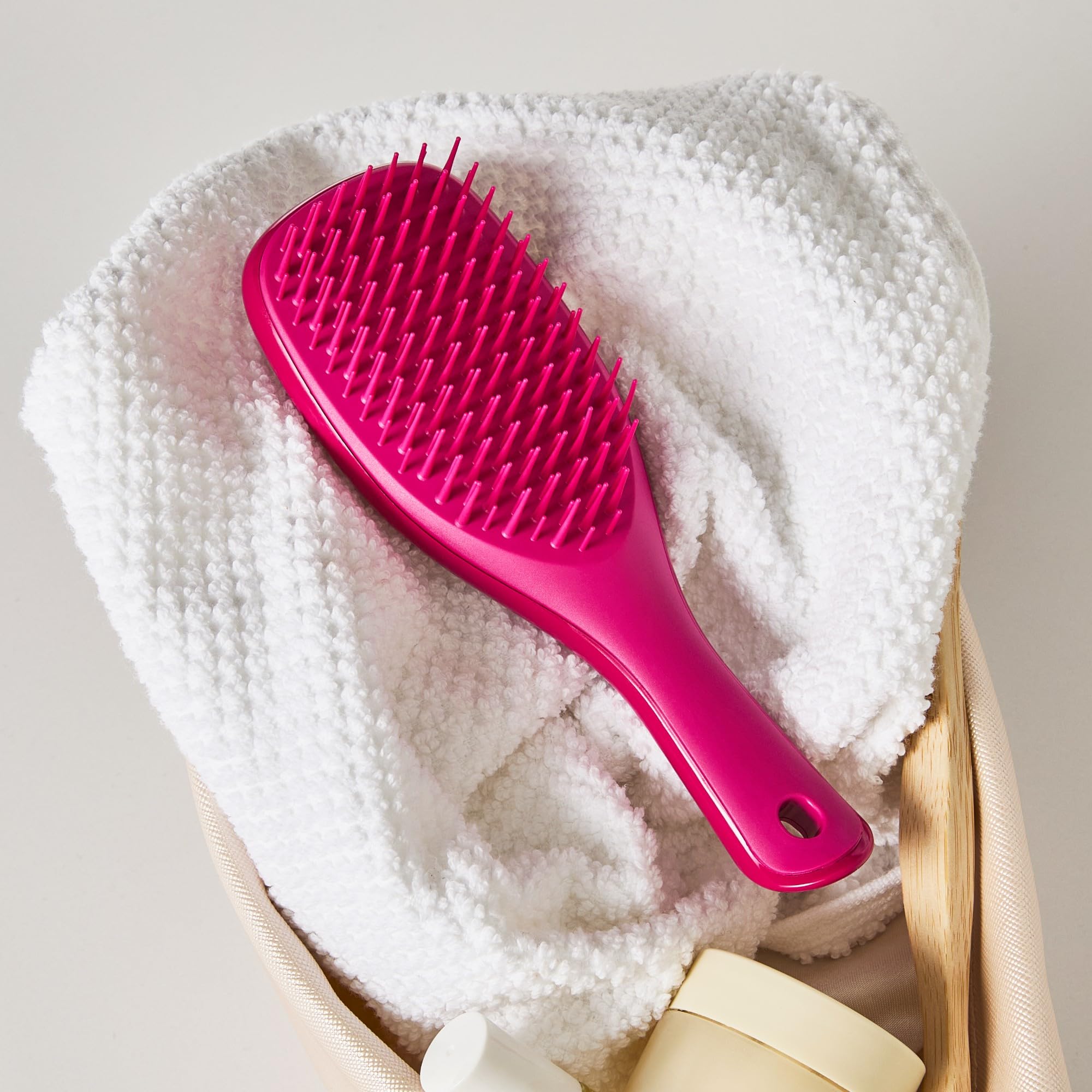 Compact brush tucked in purse for travel with Tangle Teezer Ultimate Detangler