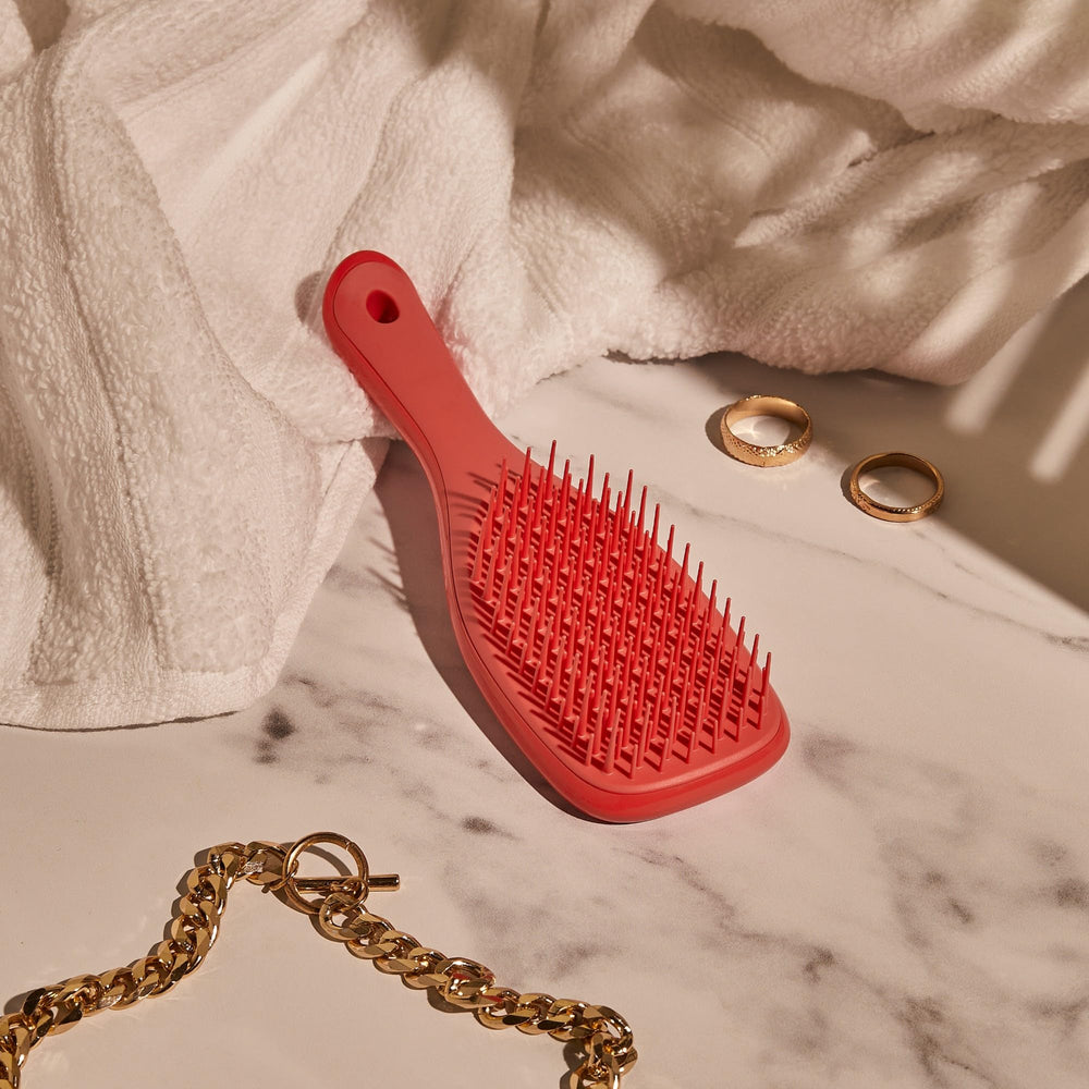 Tangle Teezer packaging and display highlighting travel-friendly portability.
