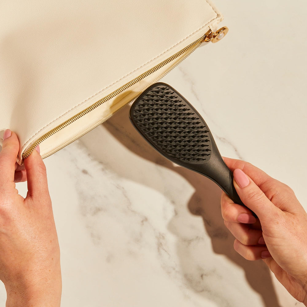 Packaging transition for sustainability with Tangle Teezer Ultimate Detangler.