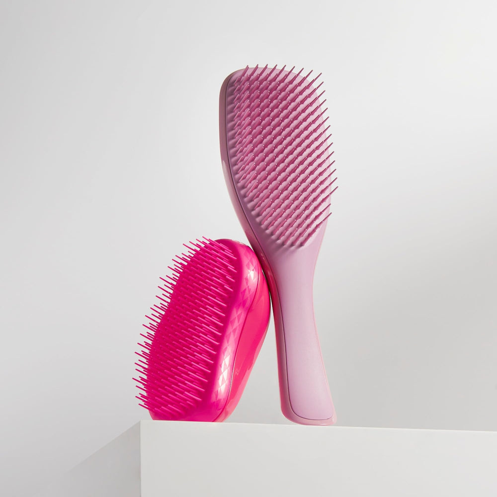 Tangle Teezer Ultimate Detangler close-up showing two-tiered teeth in grip-friendly handle.