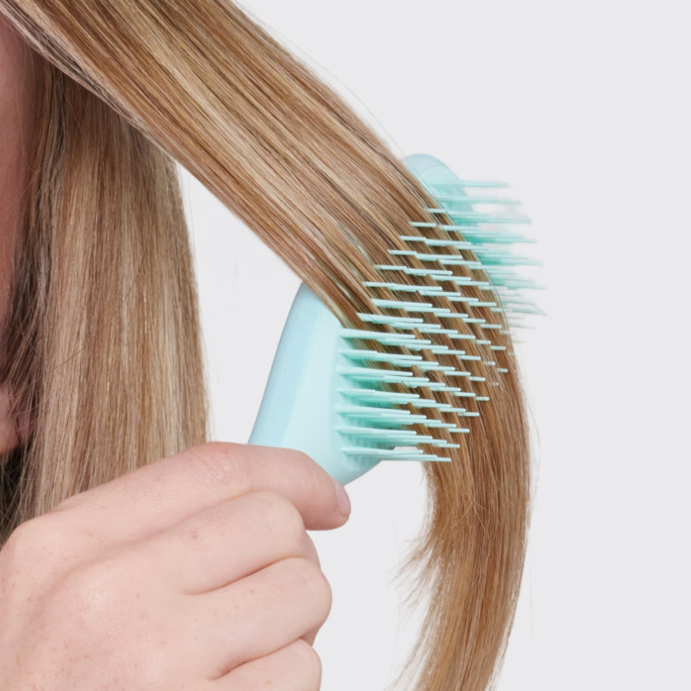 Tangle Teezer mint brush aiding quick daily detangling routines