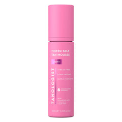 Tanologist Light Self Tan Mousse bottle with natural glow promise.