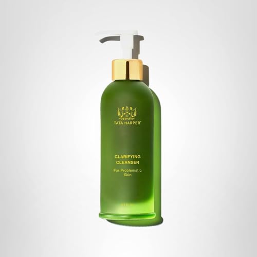Tata Harper Clarifying Cleanser in-use scene showing sleek bottle on vanity.