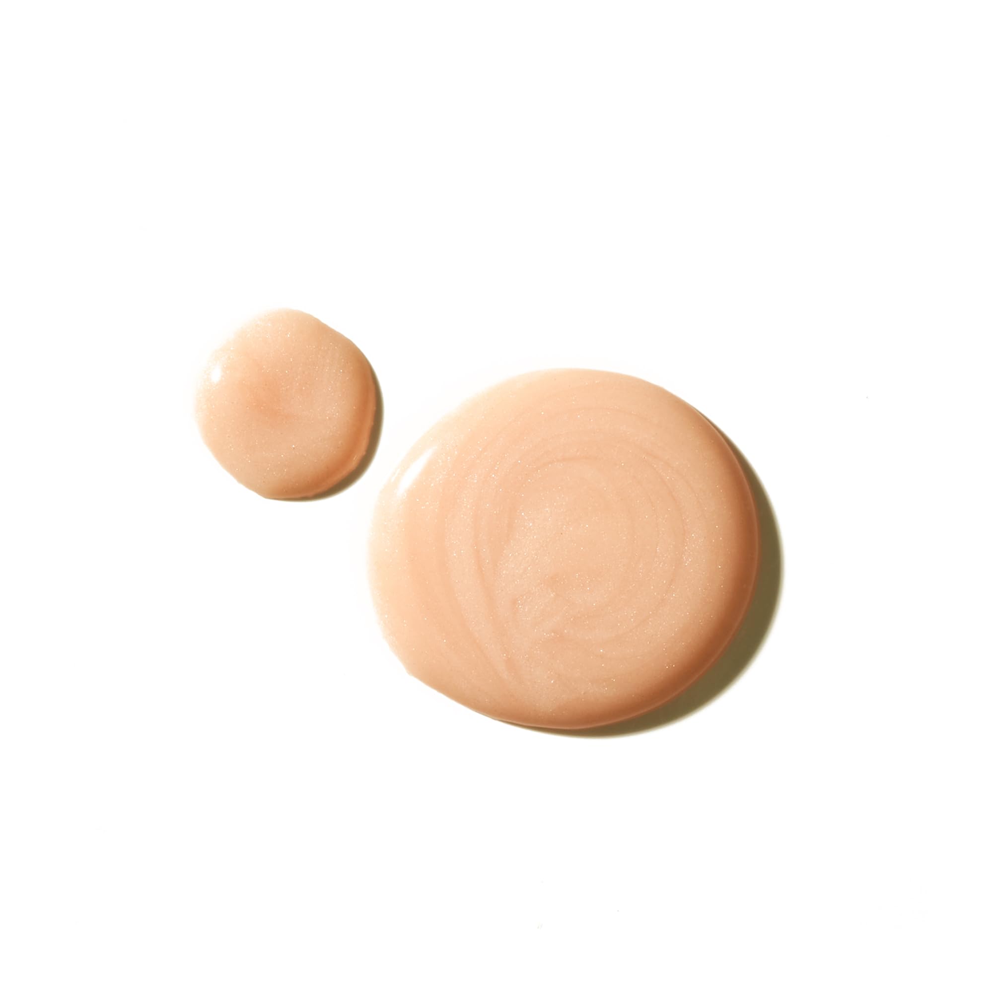 Tata Harper Resurfacing Serum glow application close-up showing silky texture