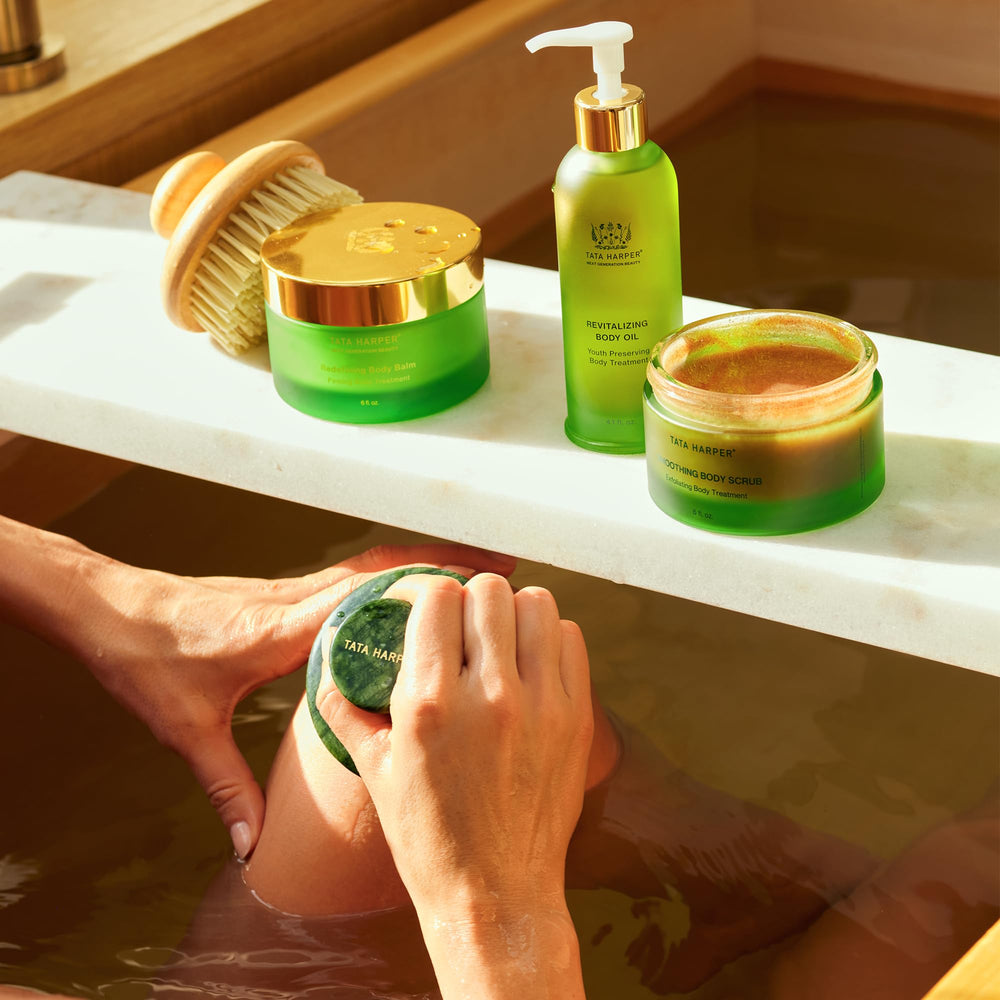 Tata Harper Revitalizing Body Oil packaging display highlights premium design for daily care.
