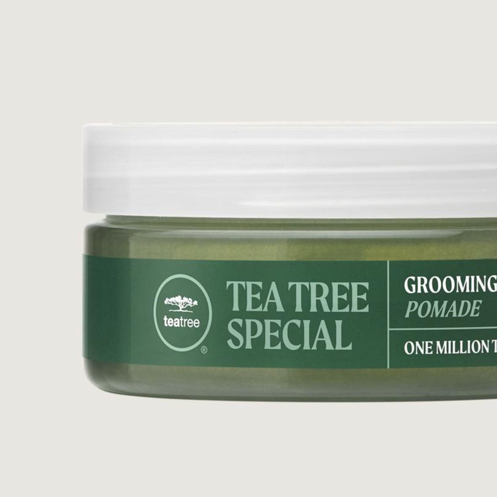 Shiny finish of Tea Tree Grooming Pomade closeup emphasizing gloss.
