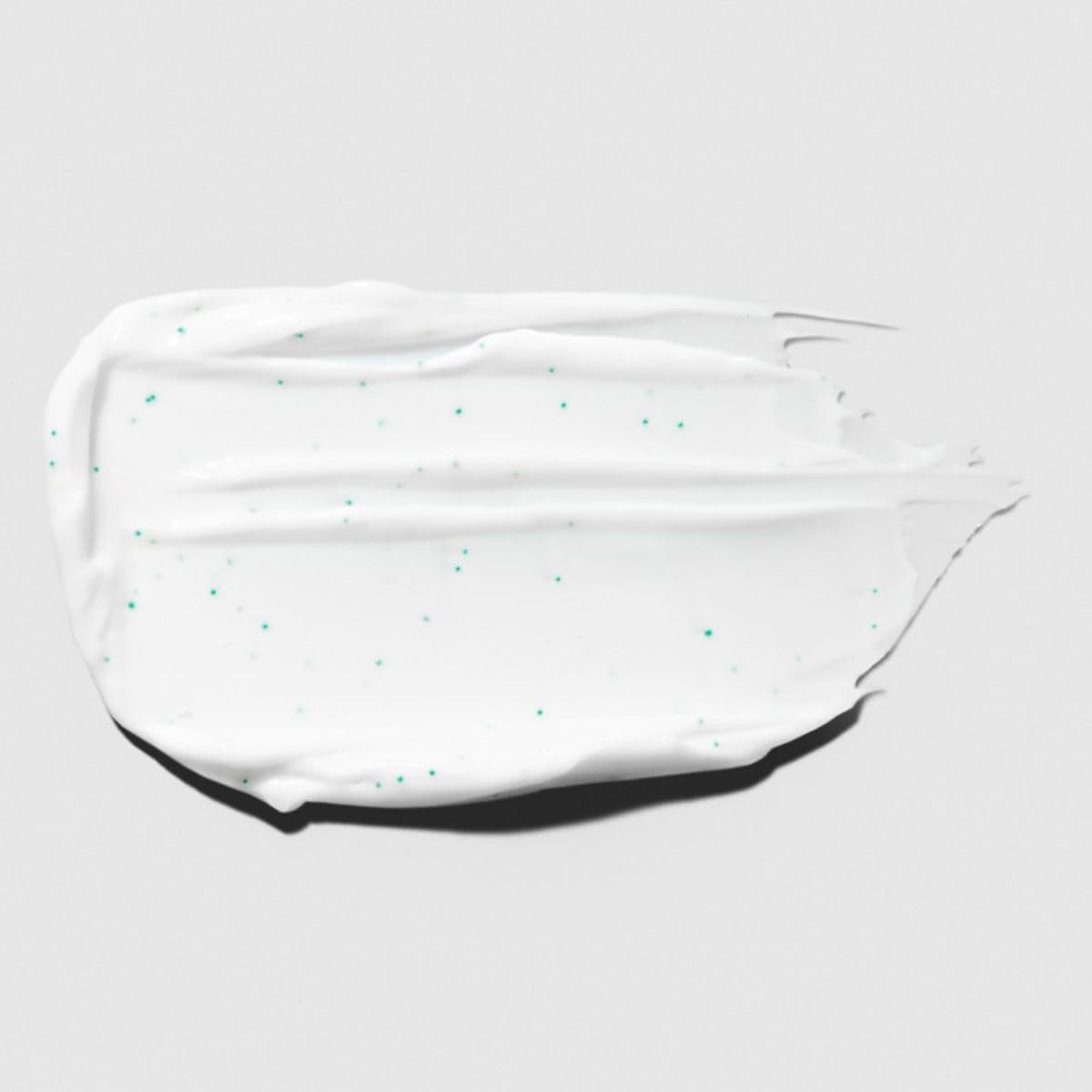 Tea Tree Hair Mask being applied to damp hair for conditioning.