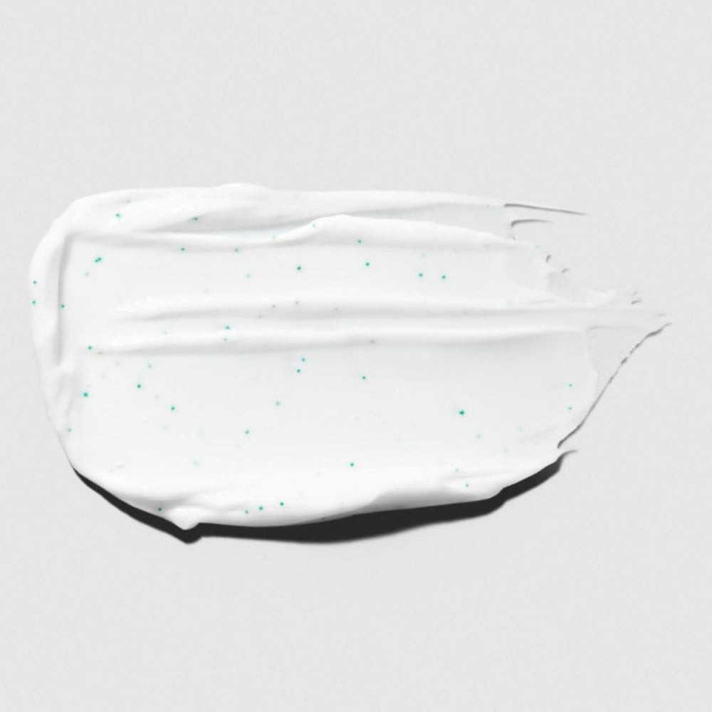 Tea Tree Hair Mask being applied to damp hair for conditioning.