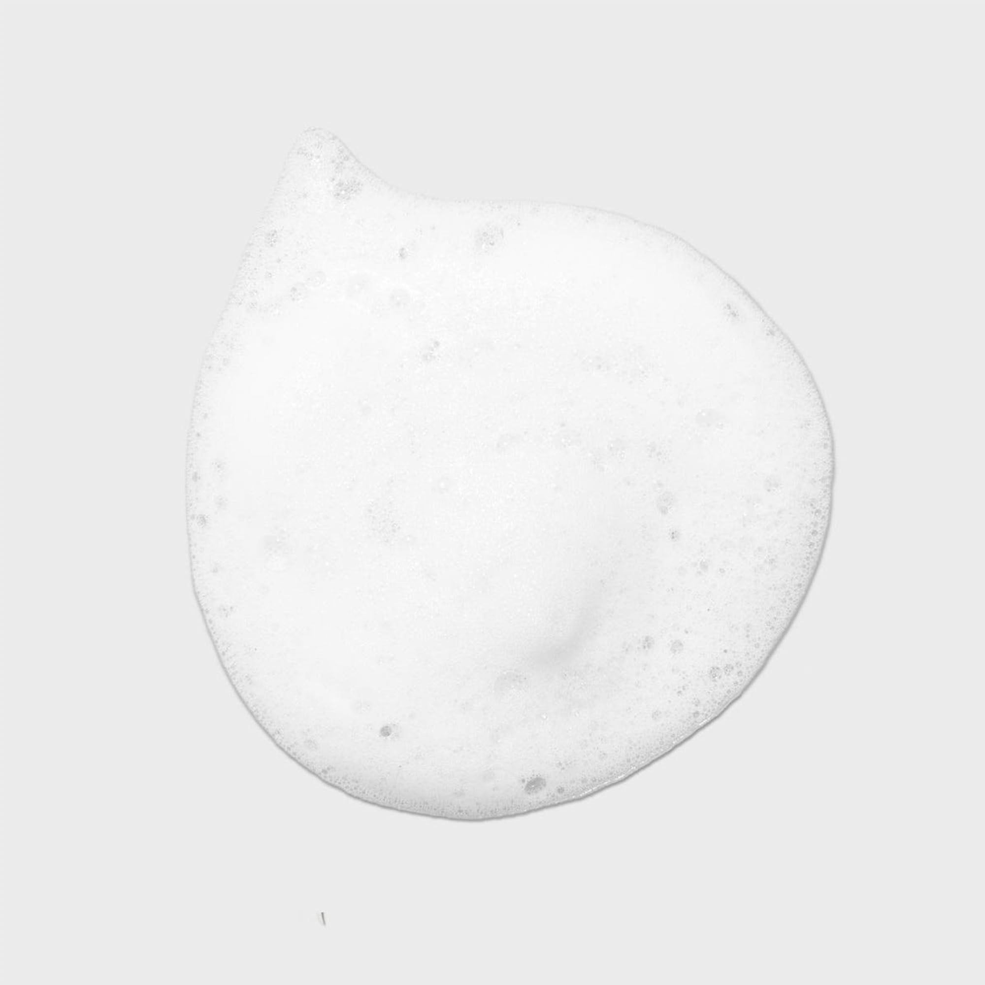 Tea Tree Lavender Mint Curl Refresh Foam texture close-up showing curl definition