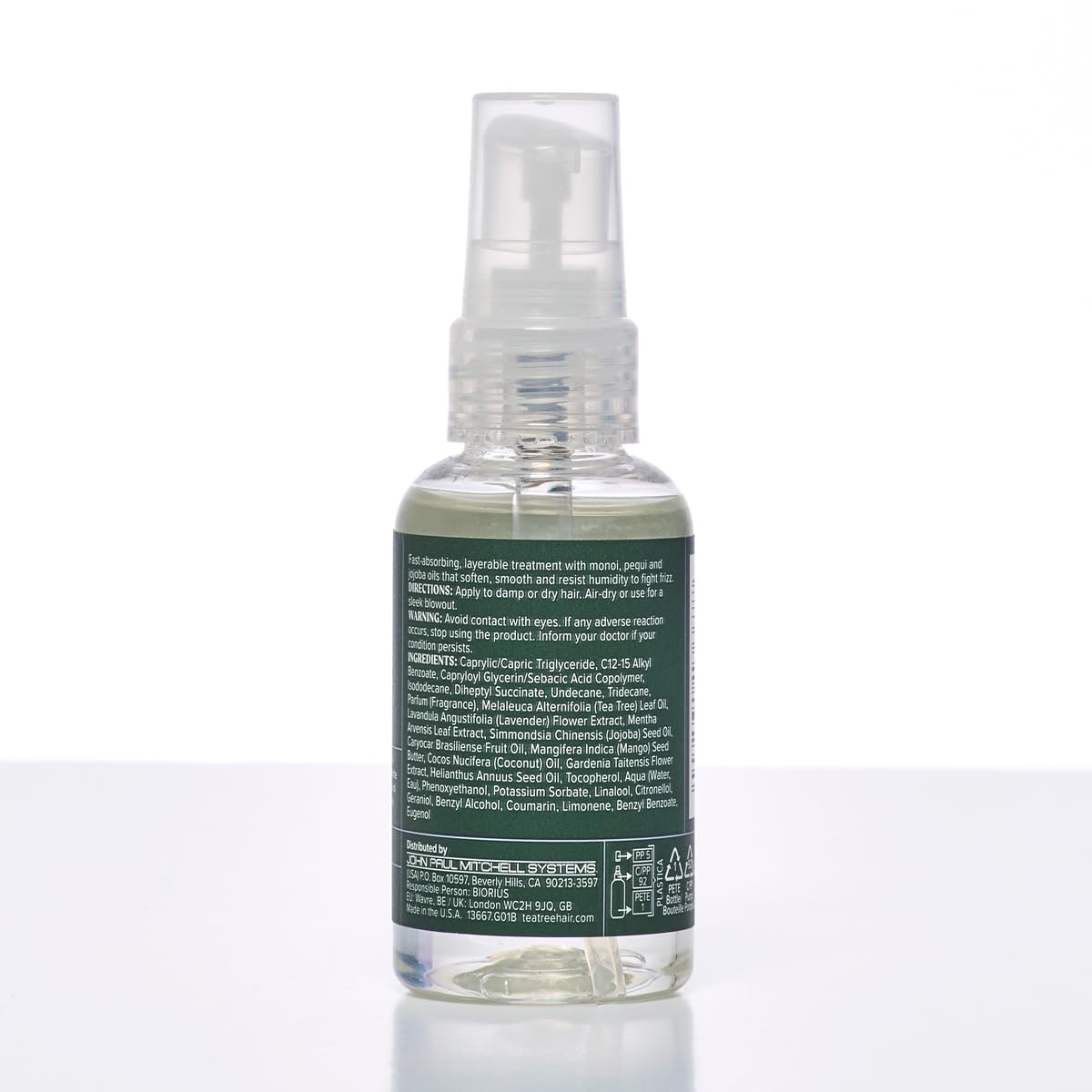 Tea Tree Lavender Mint Oil on shelf with spa-inspired branding.